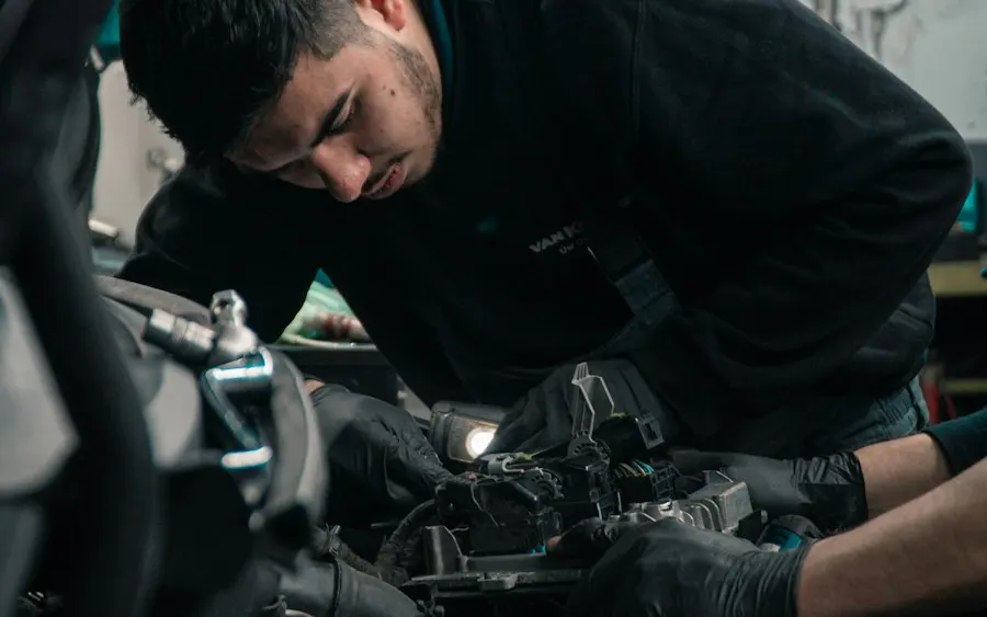 Mechanic servicing a car engine