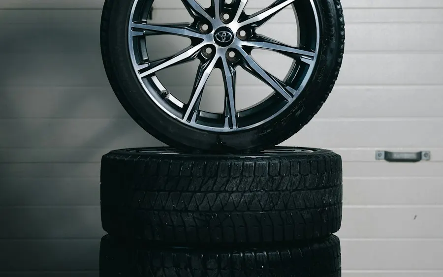 Stack of new tyres with an alloy wheel
