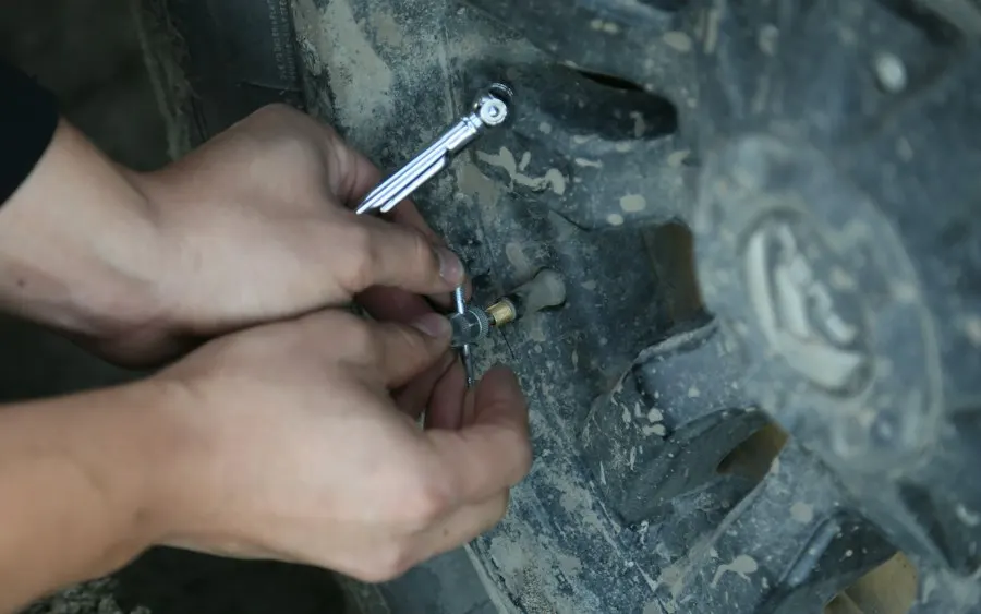 Technician repairing a tyre puncture